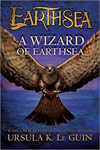 Cover of the Houghton Mifflin paperback edition of A Wizard of Earthsea by Ursula K. Le Guin, showing a large brown hawk with wings fully spread against a deep blue night sky over water